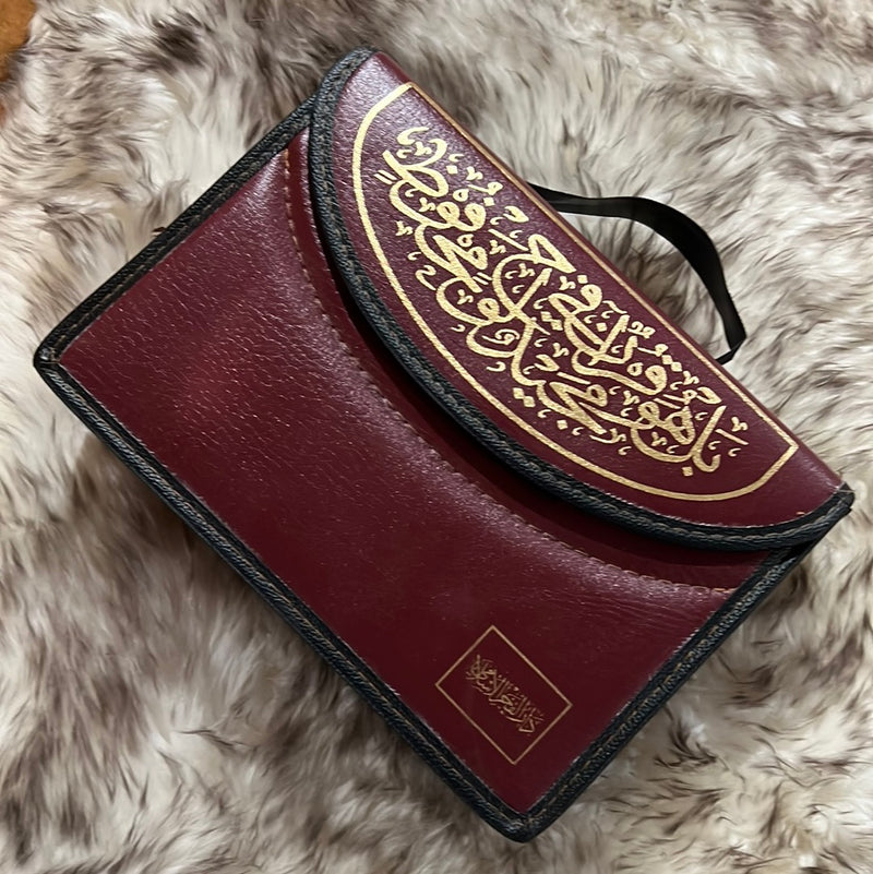 Quran in leather bag with color coded Tajweed